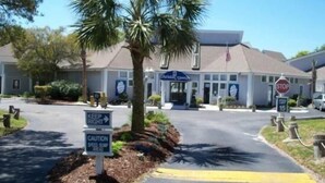 A building with a sign that reads "Keep Right" and another that says "Caution Speed Bump Ahead". - Lake Arrowhead Element (Myrtle Beach)