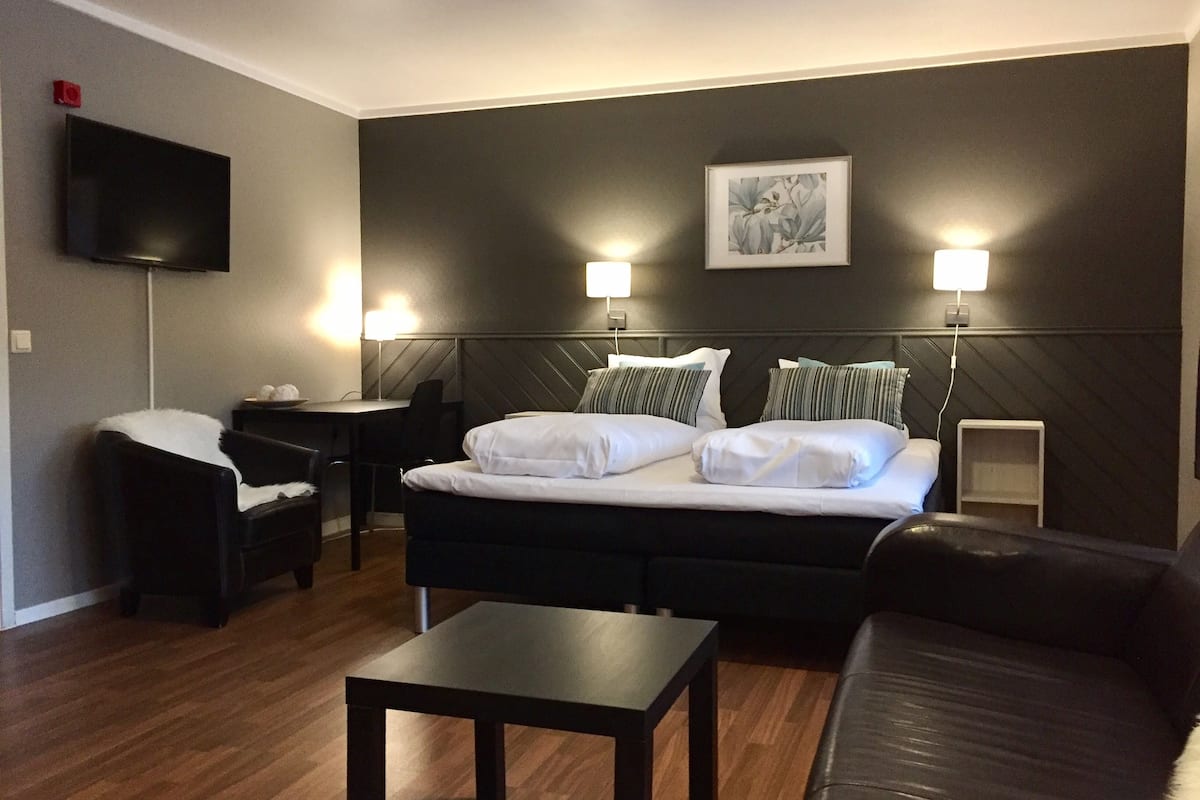 family room | pillow-top beds, desk, blackout curtains, soundproofing