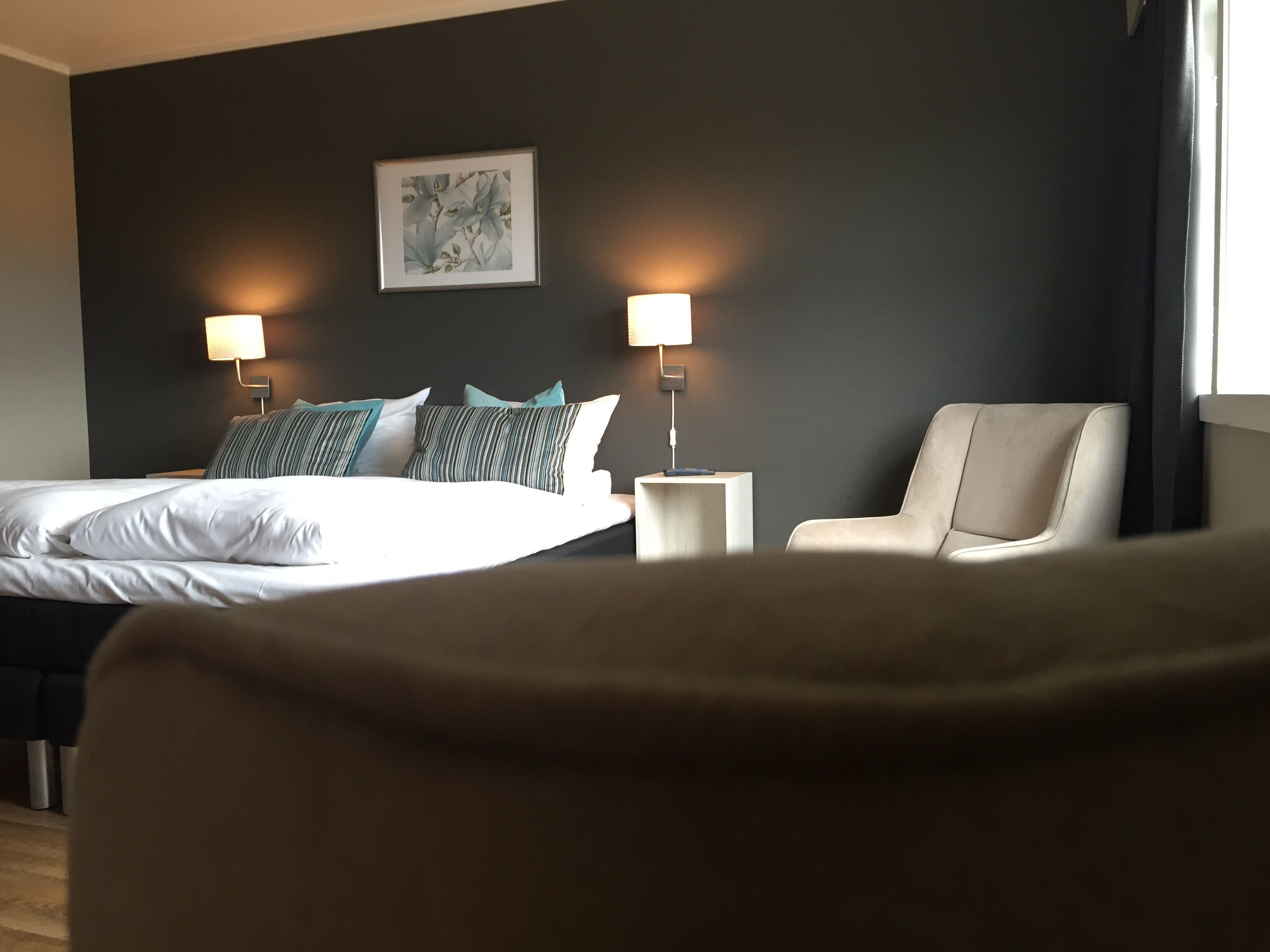 family room | pillow-top beds, desk, blackout curtains, soundproofing