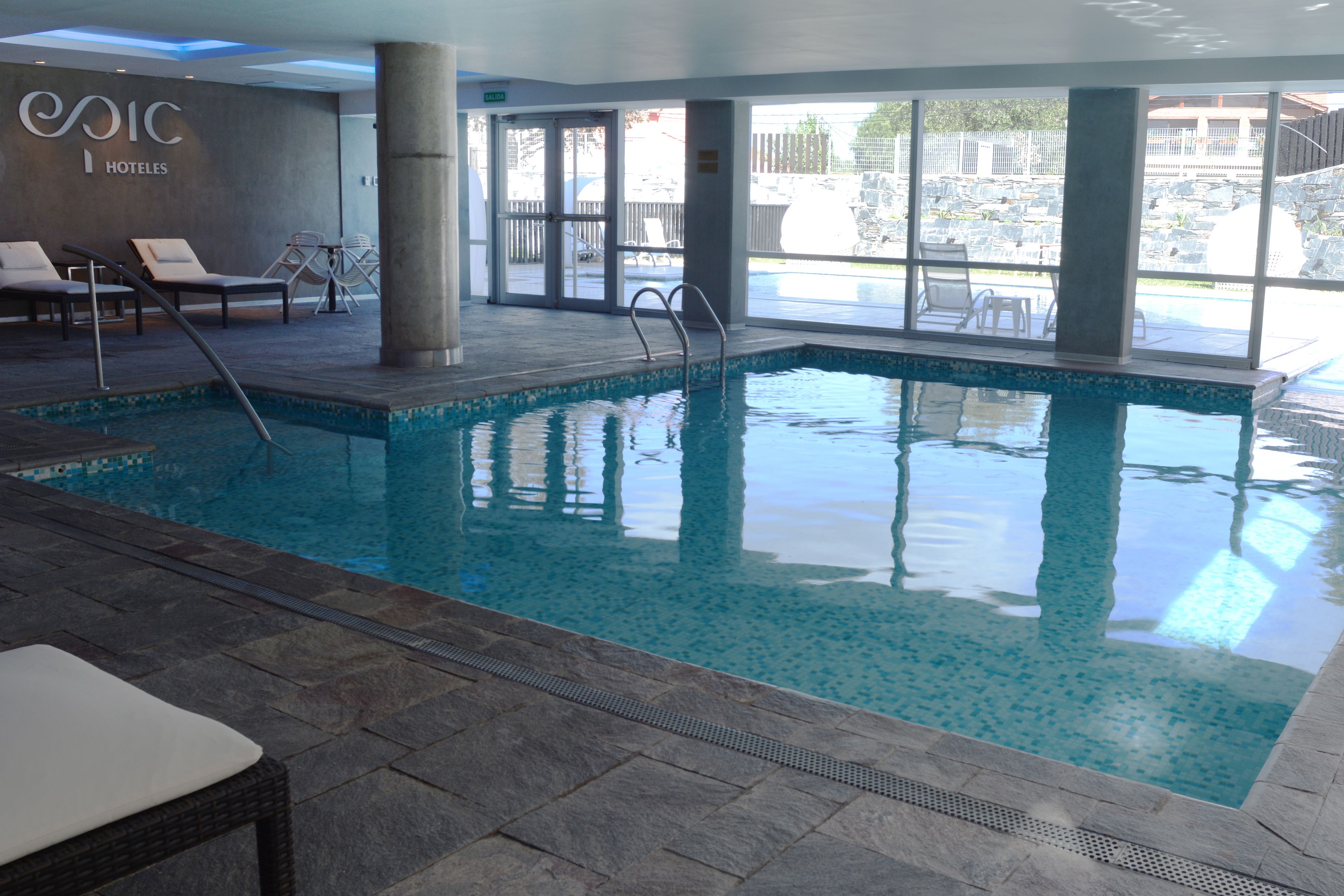 indoor pool, seasonal outdoor pool, pool umbrellas, pool loungers