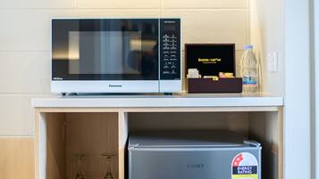 Mini-fridge, microwave, toaster, cookware/dishes/utensils