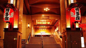 A staircase leading to a lobby with illuminated signage and a tiled floor. - Comfort Inn Fukuoka Tenjin (Fukuoka)