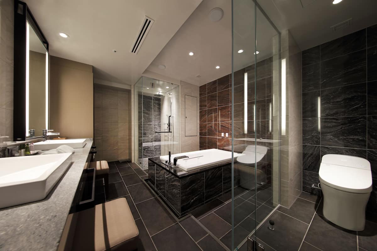 premier suite, non smoking (east) | bathroom | separate bathtub and shower, rainfall showerhead, free toiletries