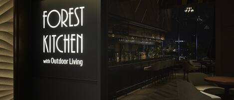 A restaurant named 'FOREST KITCHEN' with outdoor living space.