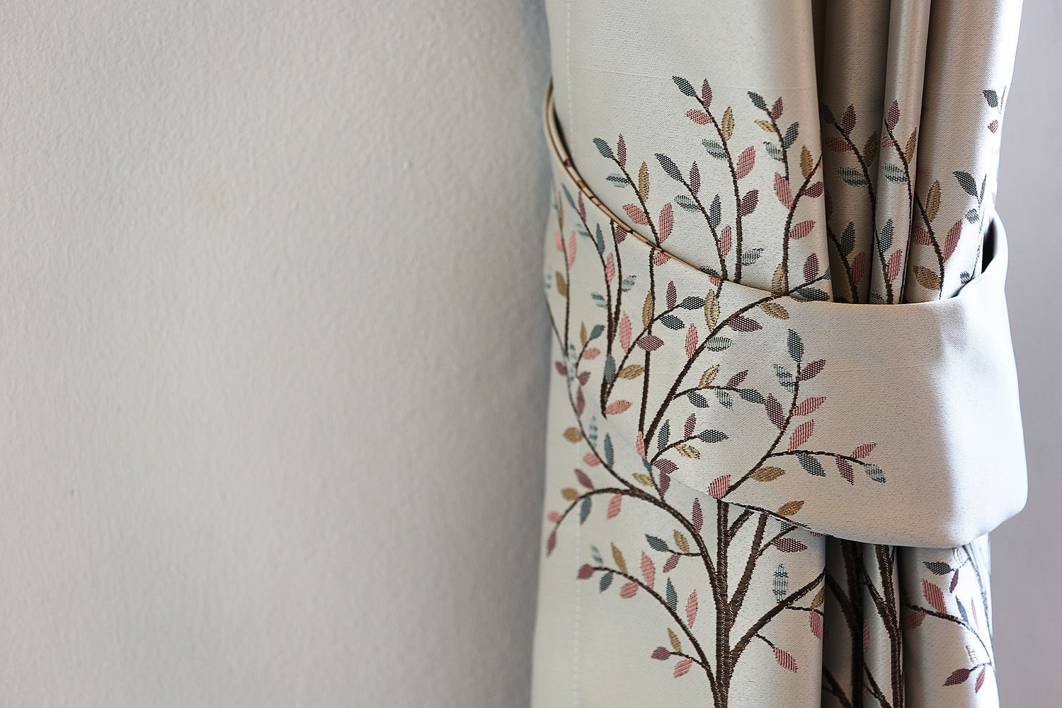 A curtain with a floral pattern.