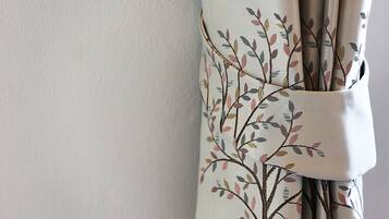 A curtain with a floral pattern.