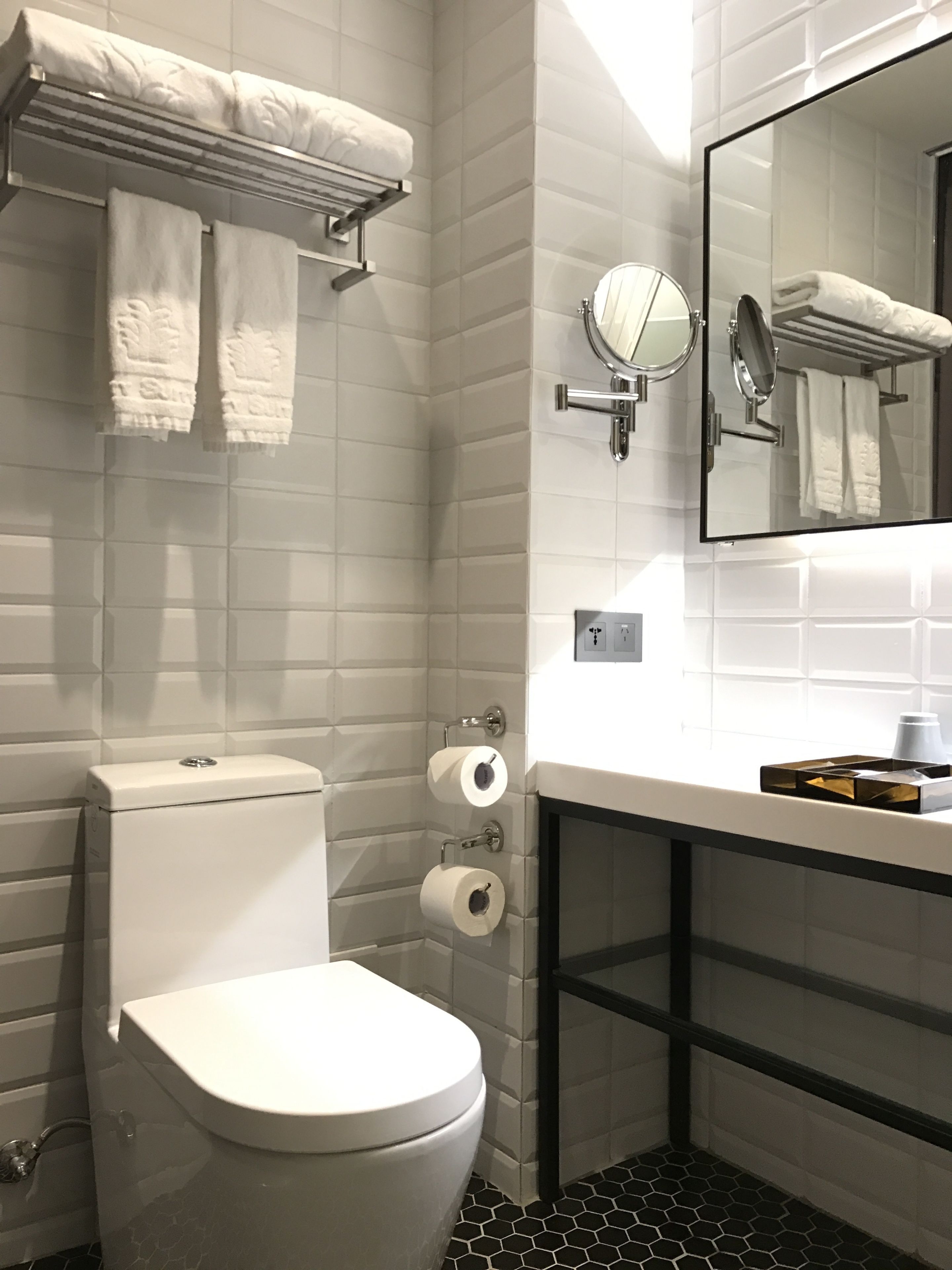 shower, hair dryer, towels, shampoo