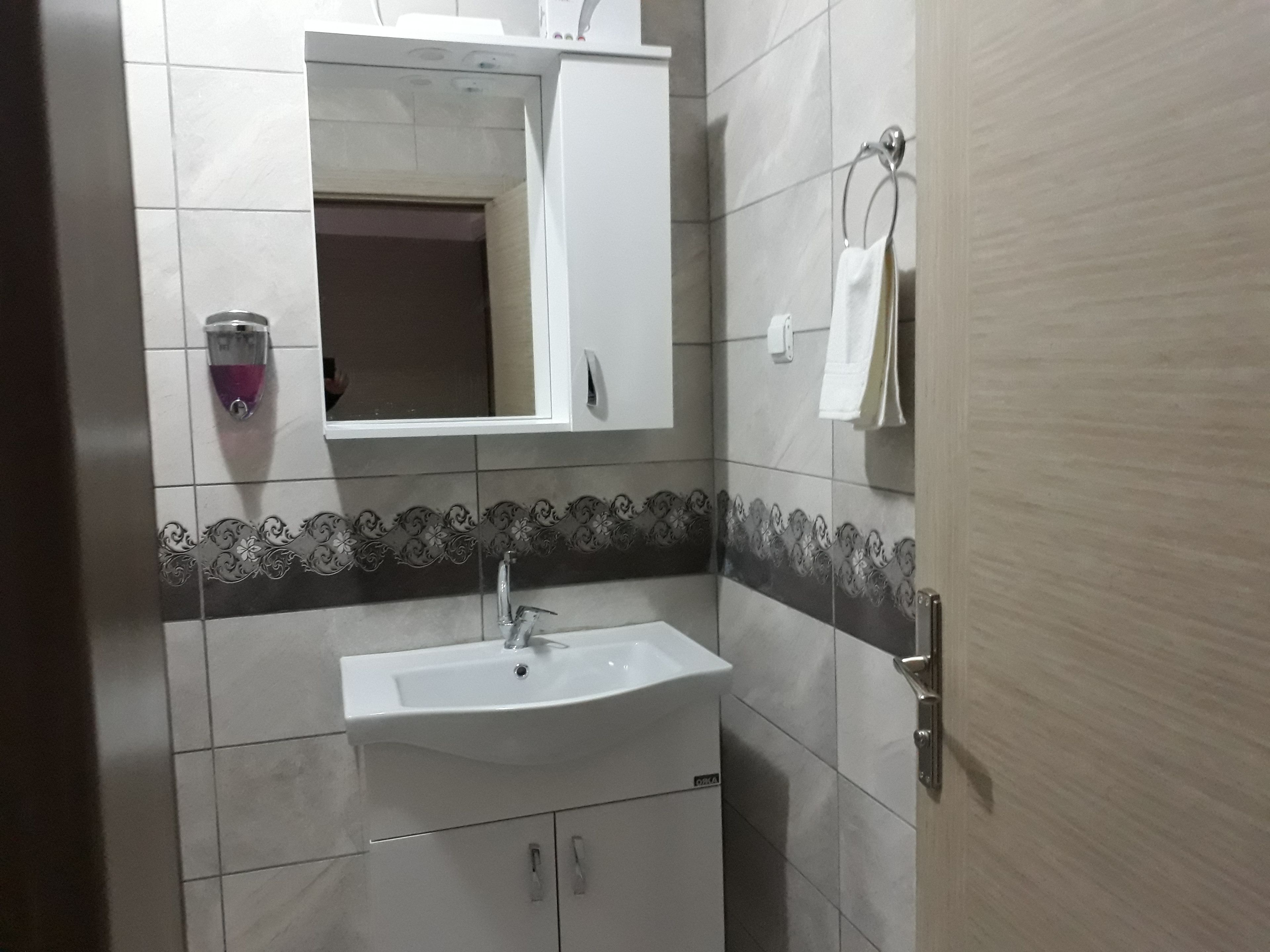 economy triple room, ensuite | bathroom | shower, hair dryer, slippers, towels