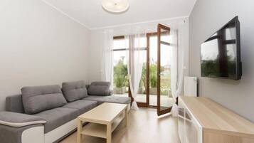 Luxury Apartment, 1 Bedroom, City View | Living room | Flat-screen TV