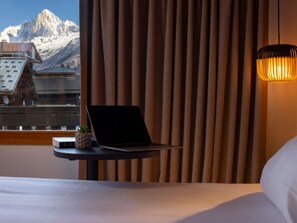 Laptop workspace, blackout drapes, soundproofing, free cribs/infant beds