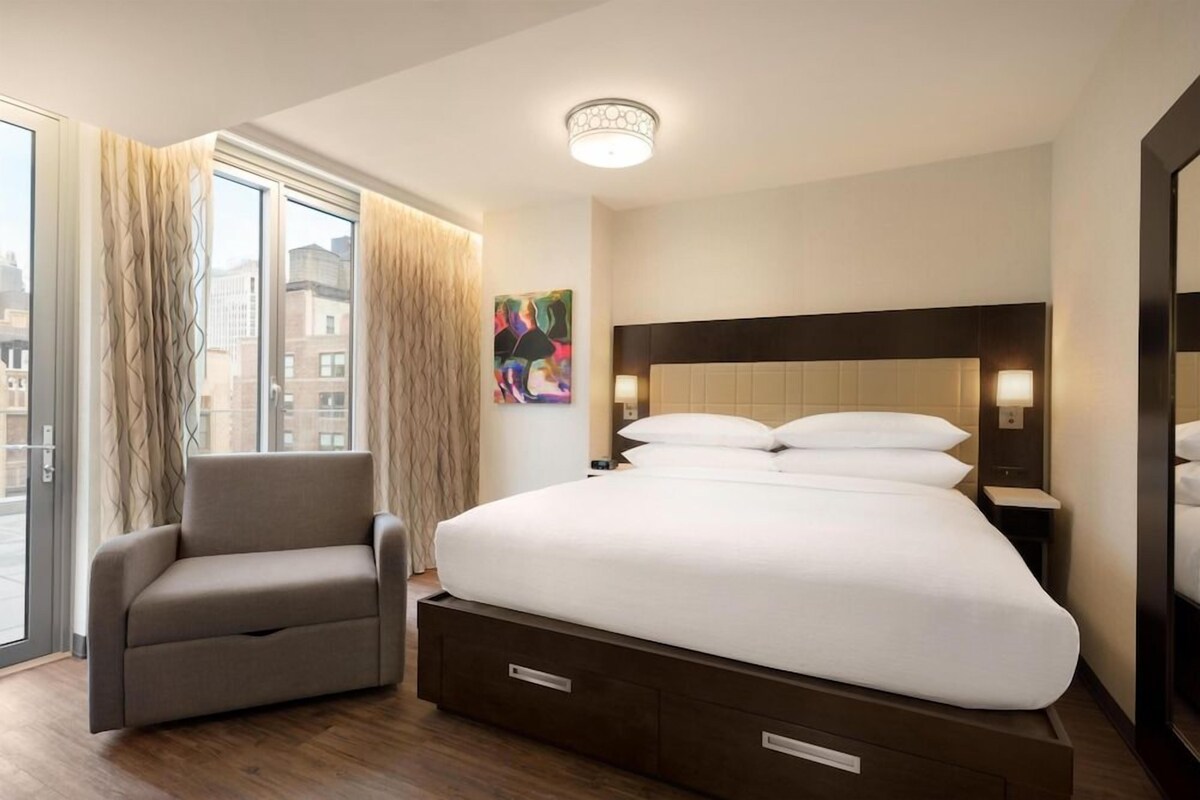 Premium bedding, down comforters, pillowtop beds, in-room safe