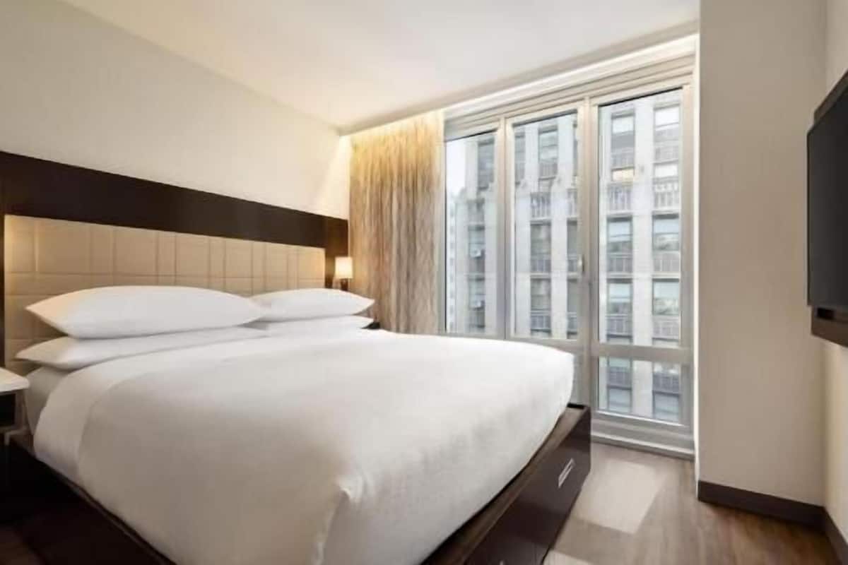 Premium bedding, down comforters, pillowtop beds, in-room safe