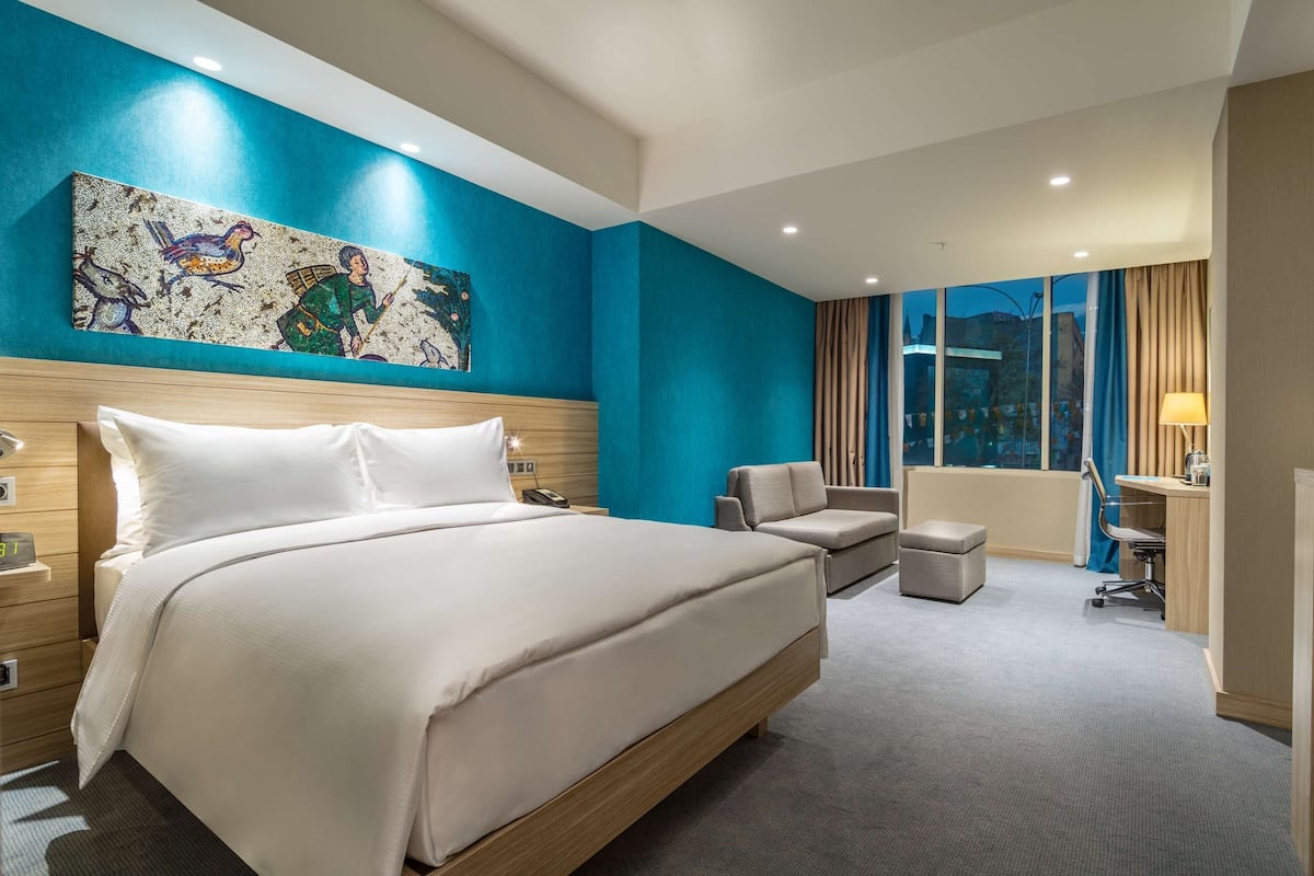 family room, 1 queen bed, smoking, balcony | living area | flat-screen tv