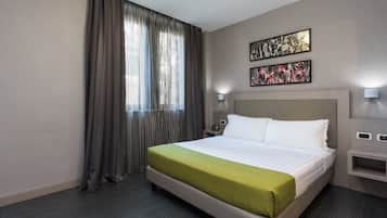 Relax in a spacious room with a large bed, abstract art, and a window with a view.