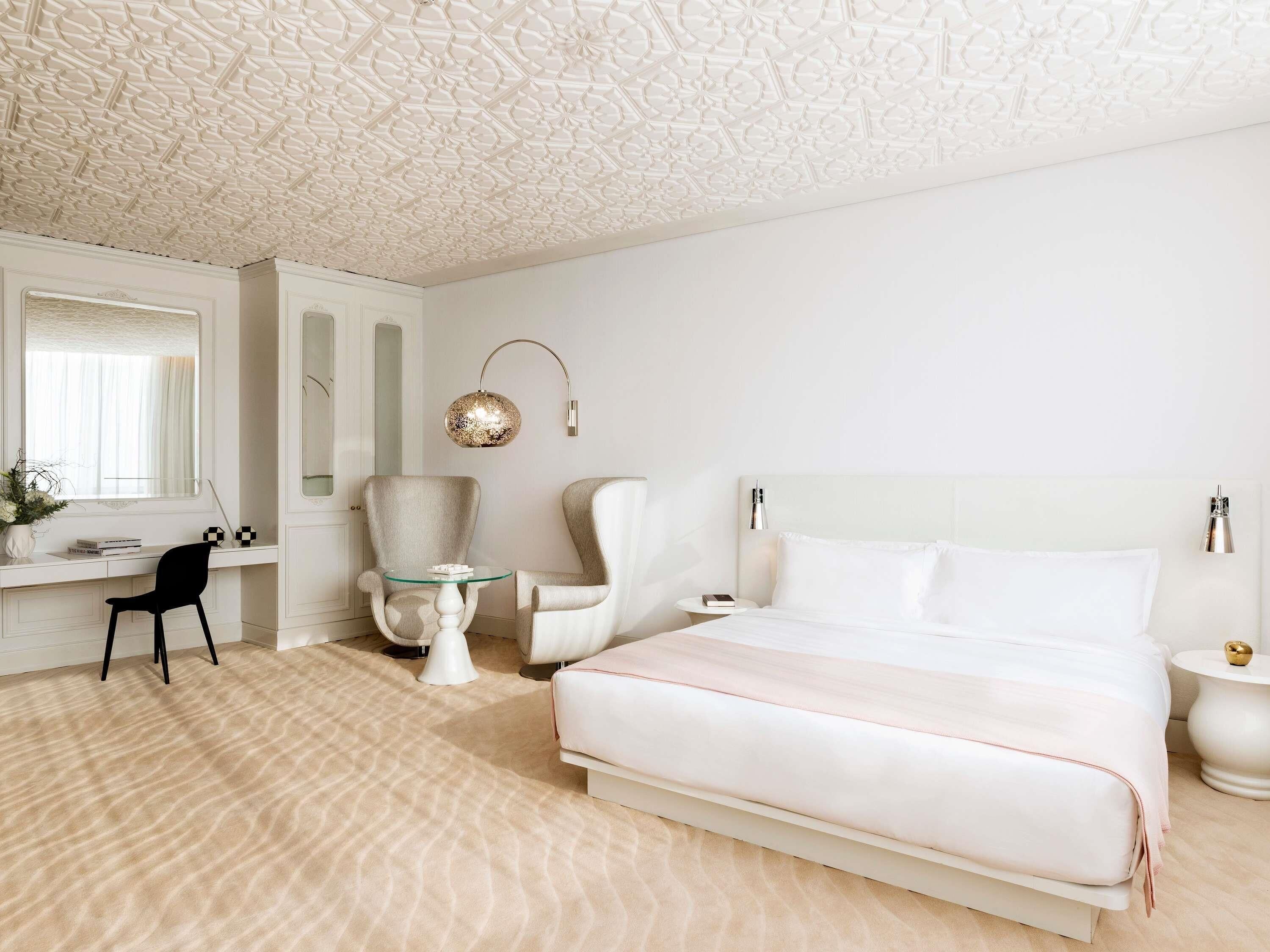 Premium bedding, down comforters, minibar, in-room safe