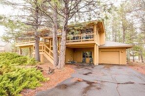 Enjoy a peaceful retreat in this cozy cabin with a balcony and inviting porch.