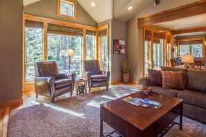 Family Apartment, 4 Bedrooms | Living room | TV, fireplace, DVD player, ping pong