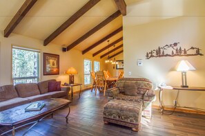 Family Apartment, 4 Bedrooms | Living area | TV, fireplace, video-game console, DVD player