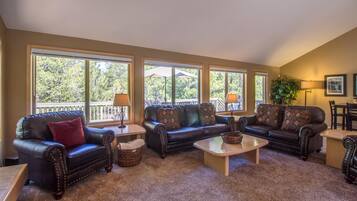 Family Apartment, 4 Bedrooms | Living area | Flat-screen TV, DVD player