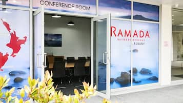 A conference room with a view of a mountainous landscape.