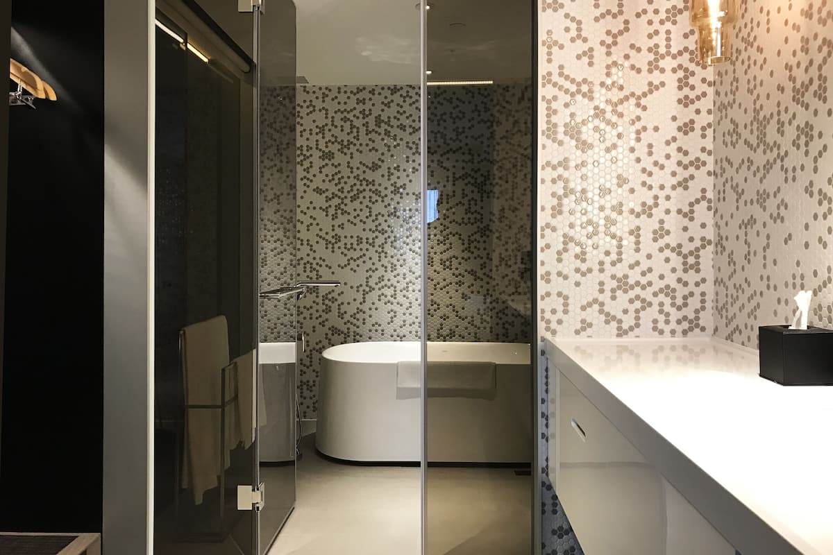 executive suite | bathroom | hair dryer, slippers, towels, soap