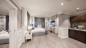 Chambre Triple Deluxe, 2 chambres, chambres communicantes | Coin séjour