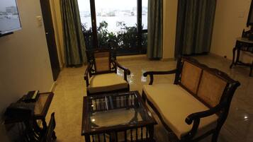 Deluxe Suite, 2 Bedrooms (1 Living Room) | Living area | Flat-screen TV