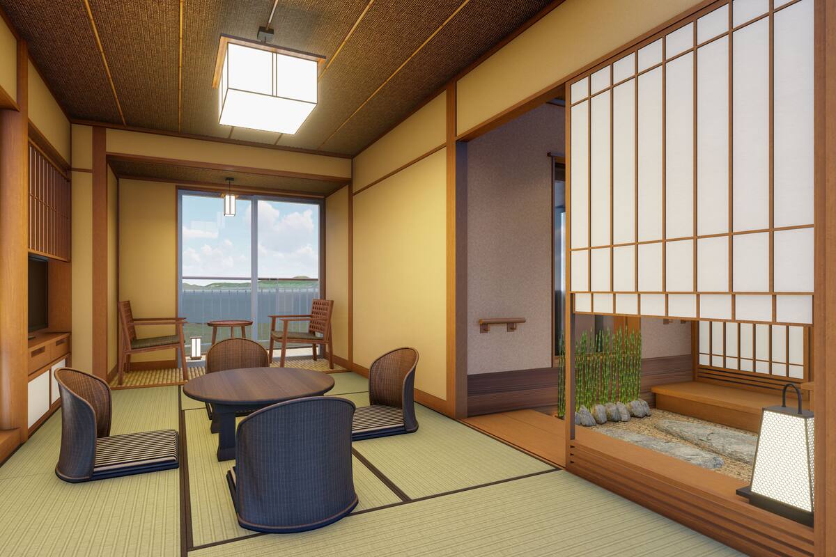Een traditionele Japanse kamer met tatami vloerbedekking, een lage tafel met vier stoelen, een schuifdeur met shoji schermen, en uitzicht op de zee.