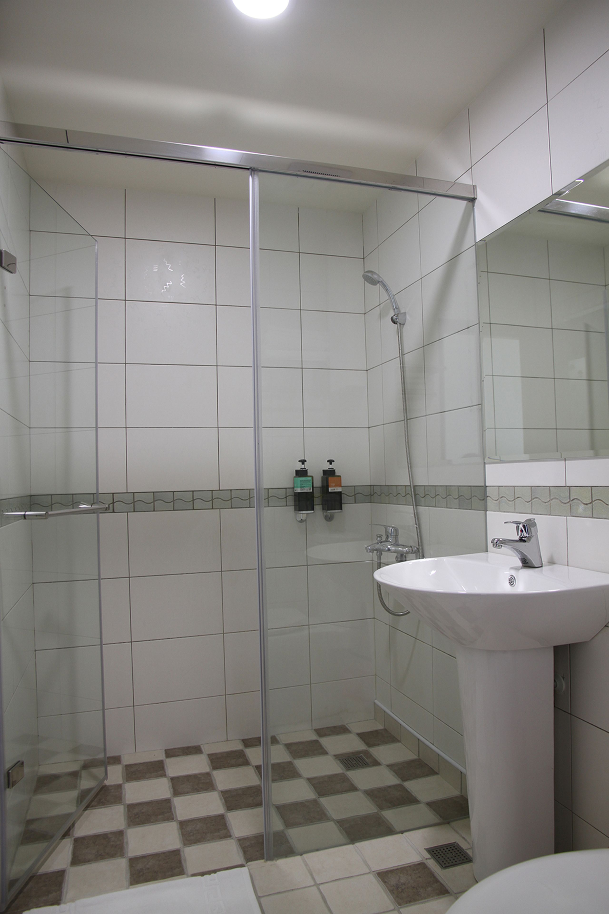 simple room | bathroom | shower, free toiletries, hair dryer, slippers