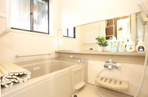 Townhome | Bathroom | Combined shower/bathtub, hair dryer, slippers, towels