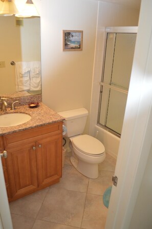 A bathroom with a sink, toilet, and shower. - Cove II 513F 2 Bedroom Condo By Midnight Cove II (Siesta Key)