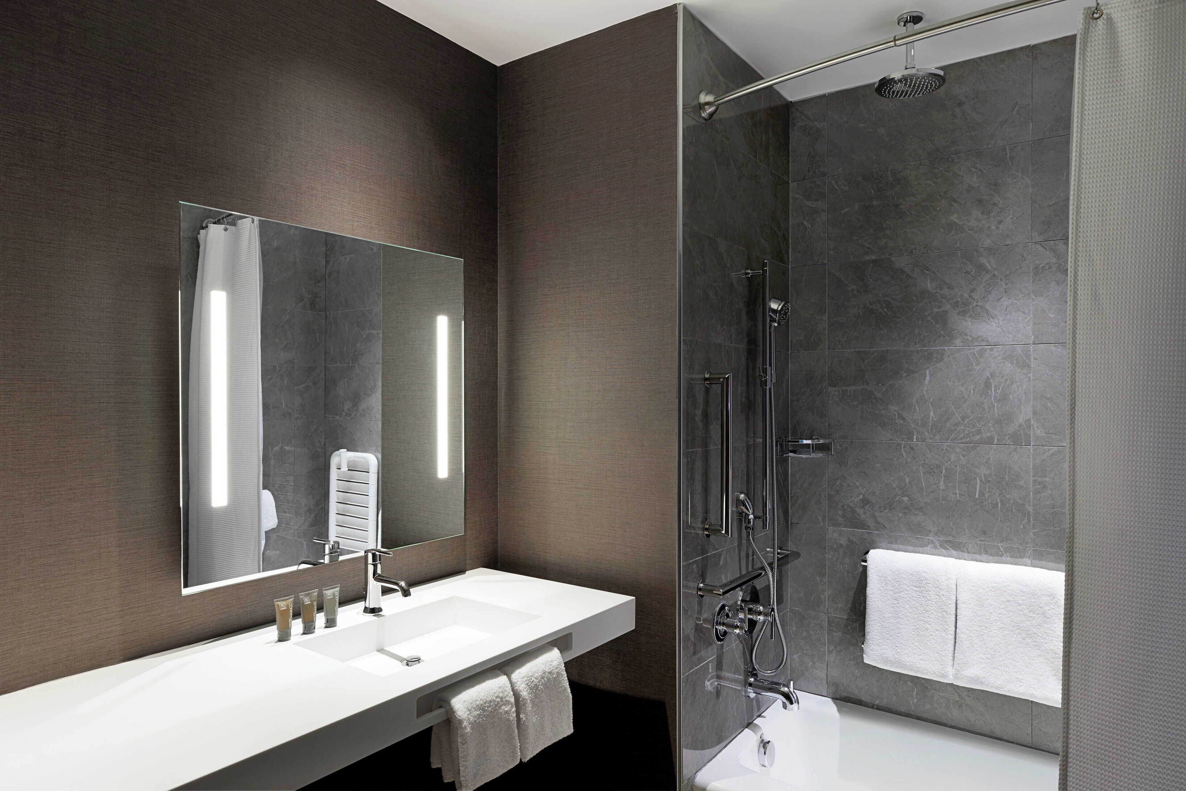 eco-friendly toiletries, hair dryer, towels