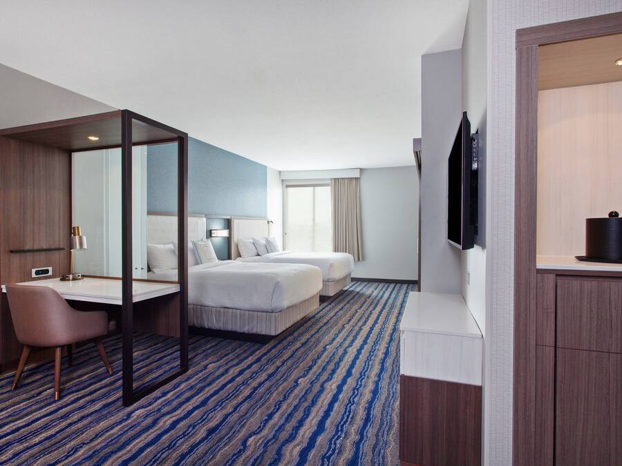 Hypo-allergenic bedding, desk, laptop workspace, blackout curtains