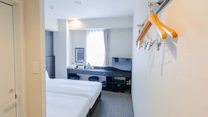 A hotel room with a bed, a desk, a mirror, a TV, and a coat rack. - The BREAKFAST HOTEL Fukuoka Tenjin (Fukuoka)