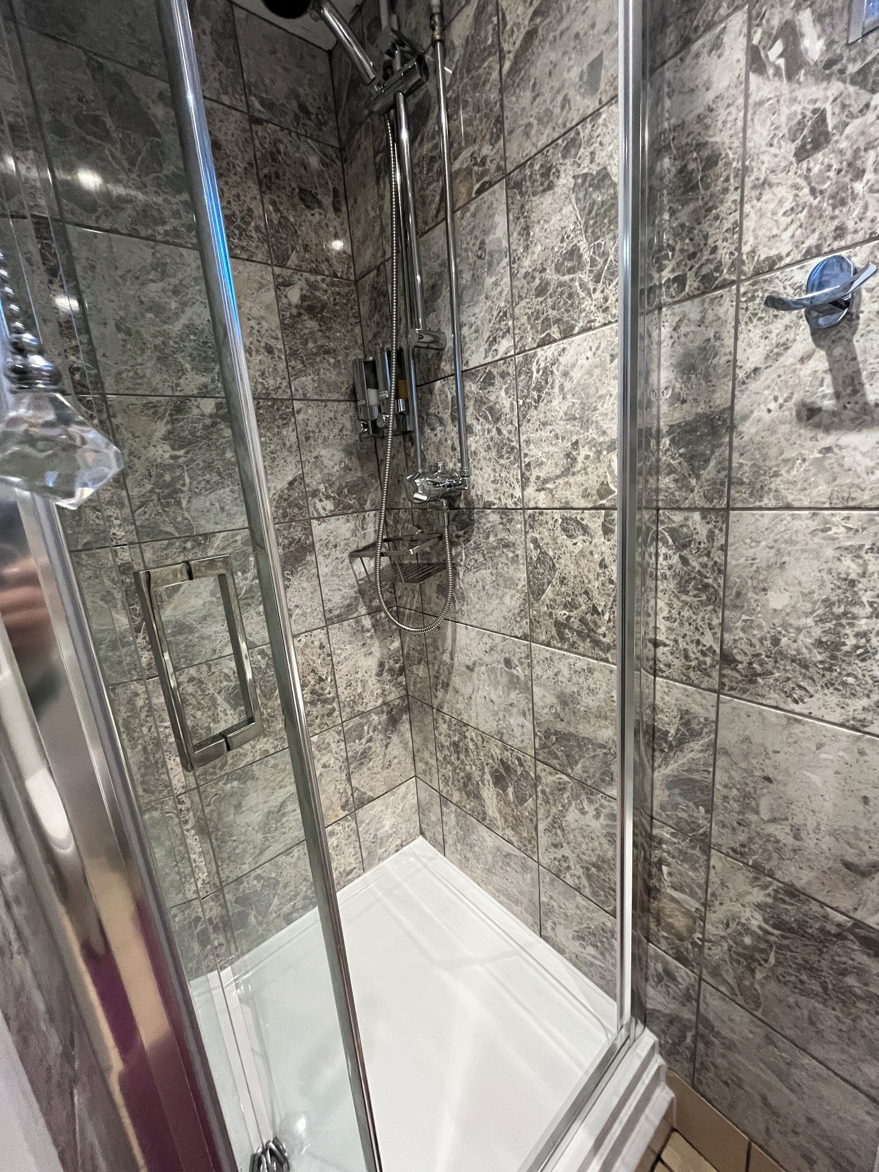 Standard Double Room | Bathroom | Shower, hair dryer, slippers, towels