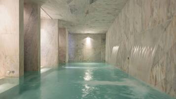 Indoor pool, open 11:00 AM to 8:00 PM, pool loungers