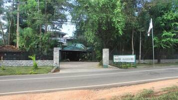 A gated entrance with a sign reading "BIRD GARDEN."