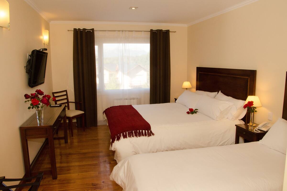 Standard Triple Room | Minibar, in-room safe, desk, soundproofing