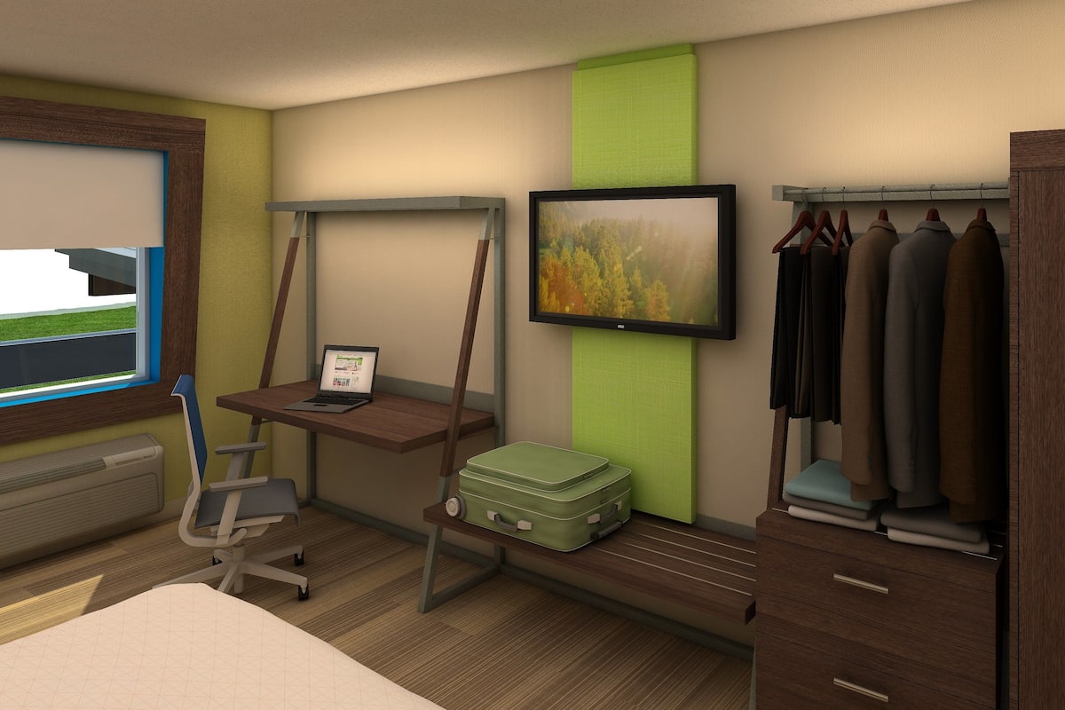 Camas con pillow-top, escritorio y tabla de planchar con plancha