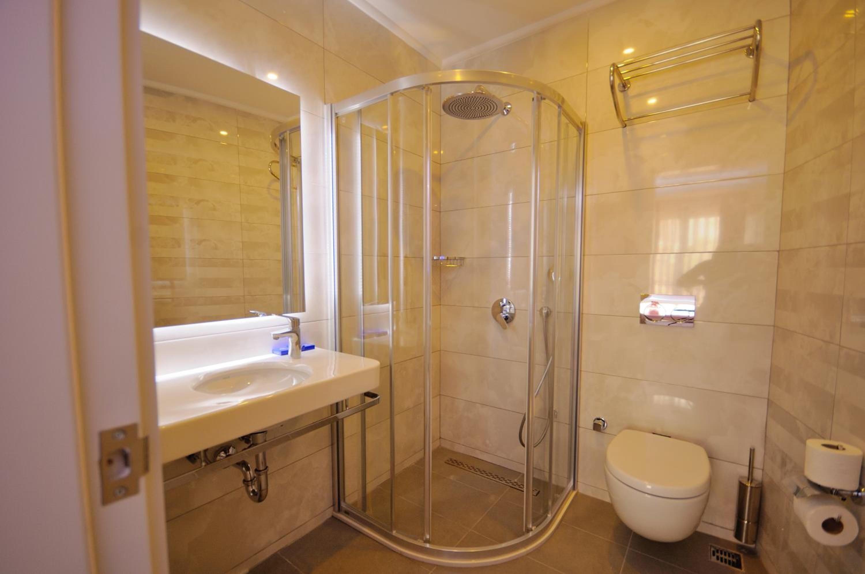 shower, rainfall showerhead, hair dryer, slippers