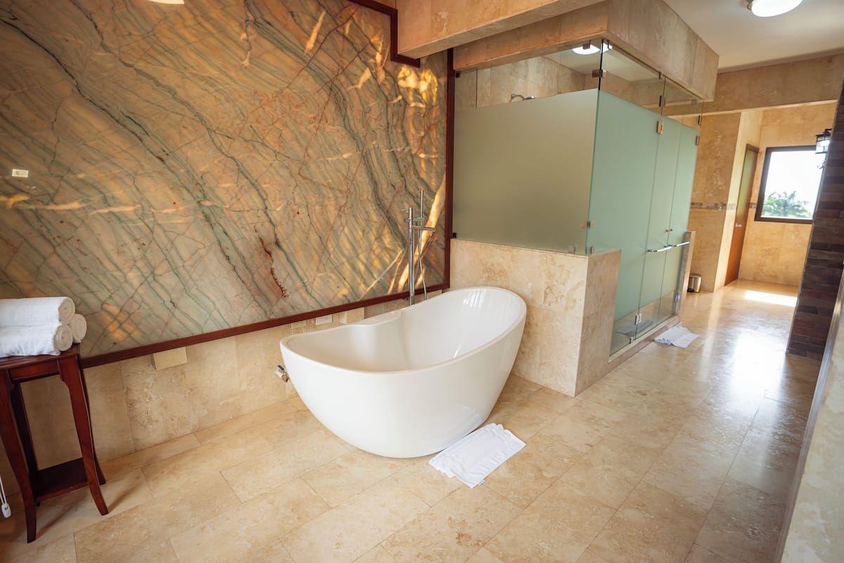 selva signature villa, volcano view | bathroom | shower, rainfall showerhead, free toiletries, hair dryer
