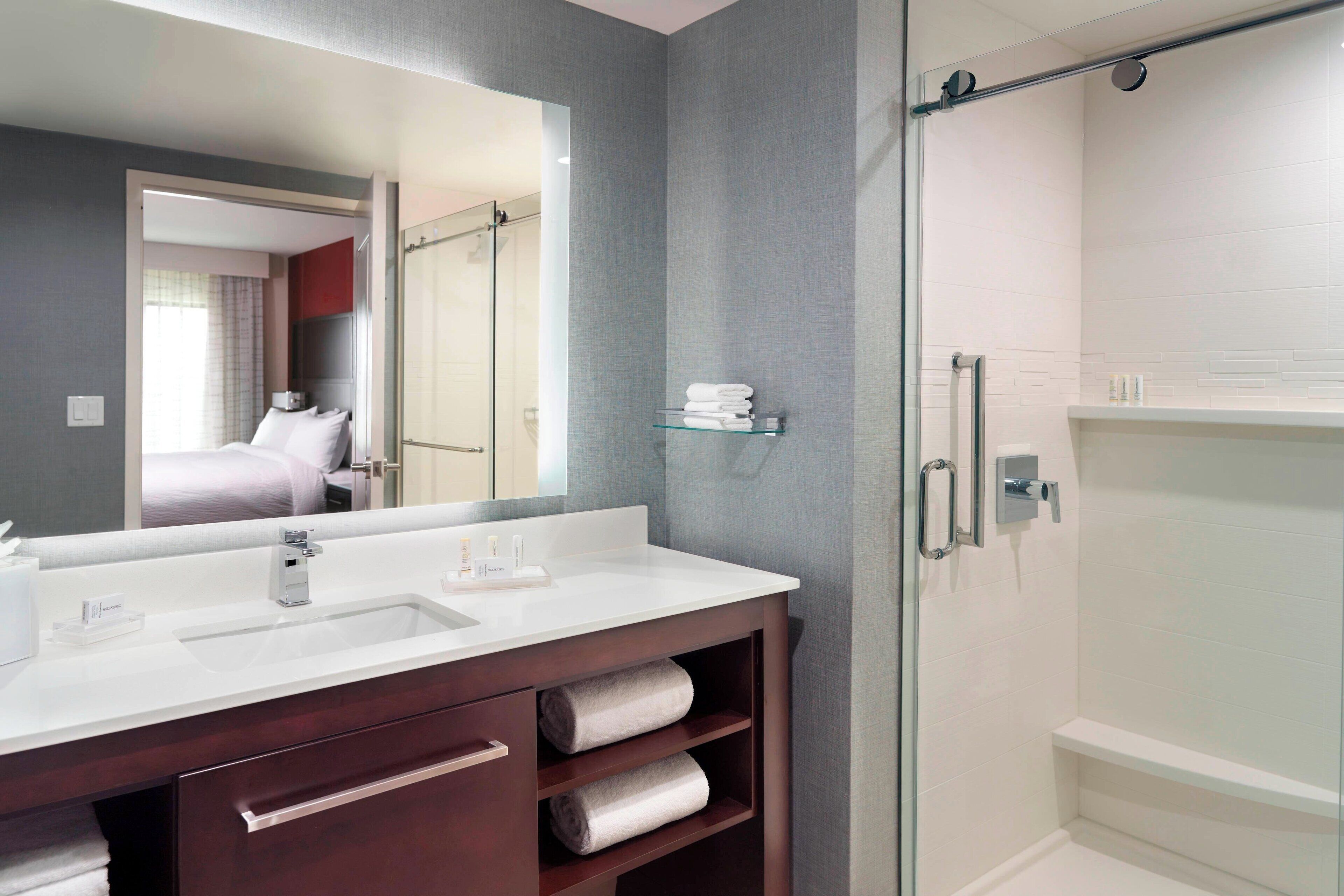 eco-friendly toiletries, hair dryer, towels