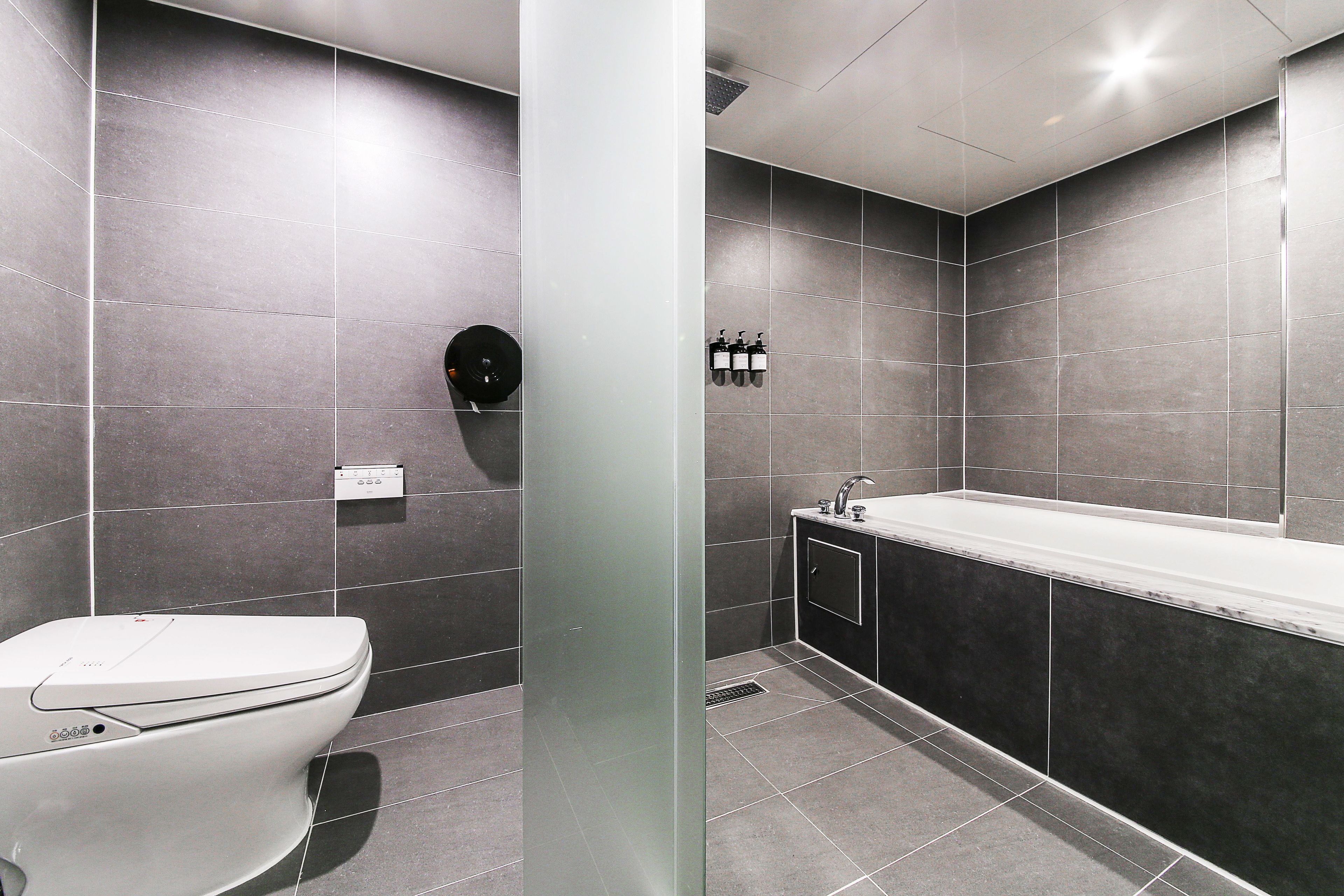 suite (twin) | bathroom | free toiletries, bathrobes, slippers, bidet