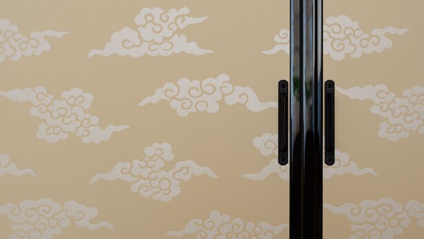 A wall with a pattern of stylized clouds. - Luck You Kyoto (Kyoto)