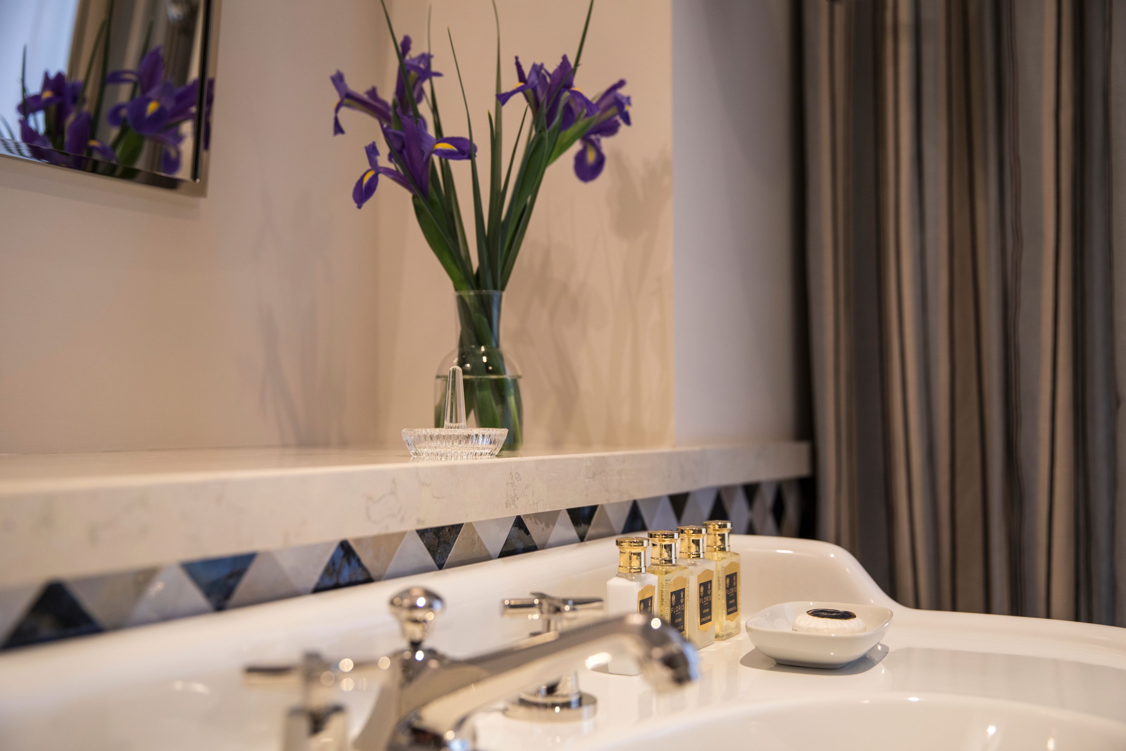 designer toiletries, hair dryer, bathrobes, slippers