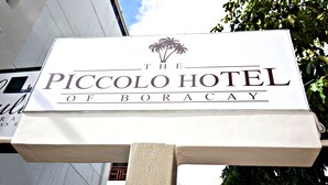 A sign for The Piccolo Hotel of Boracay.