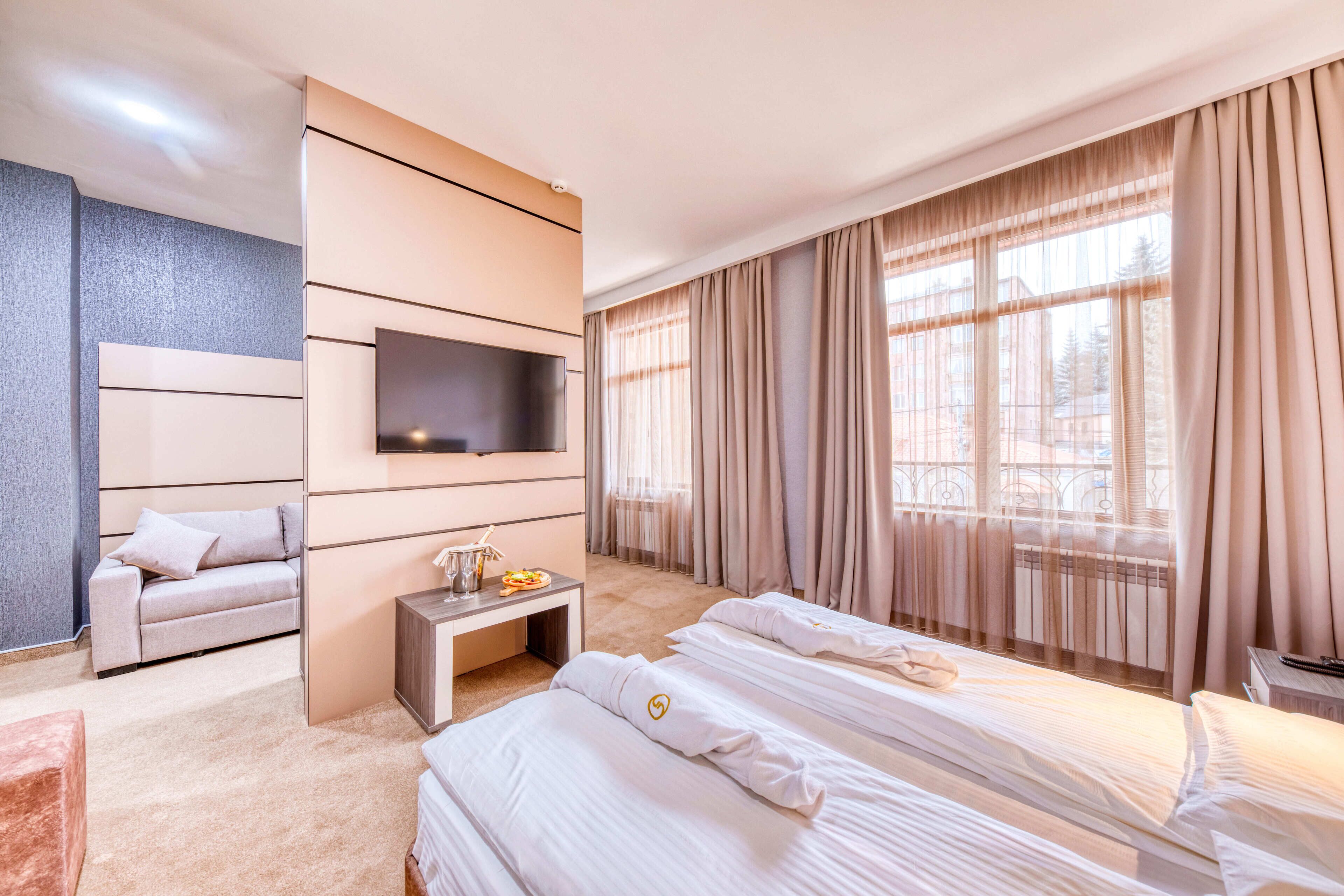 deluxe room | minibar, in-room safe, desk, blackout curtains