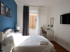 Desk, laptop workspace, free WiFi, bed sheets