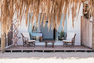 On the beach, white sand, sun loungers, beach umbrellas