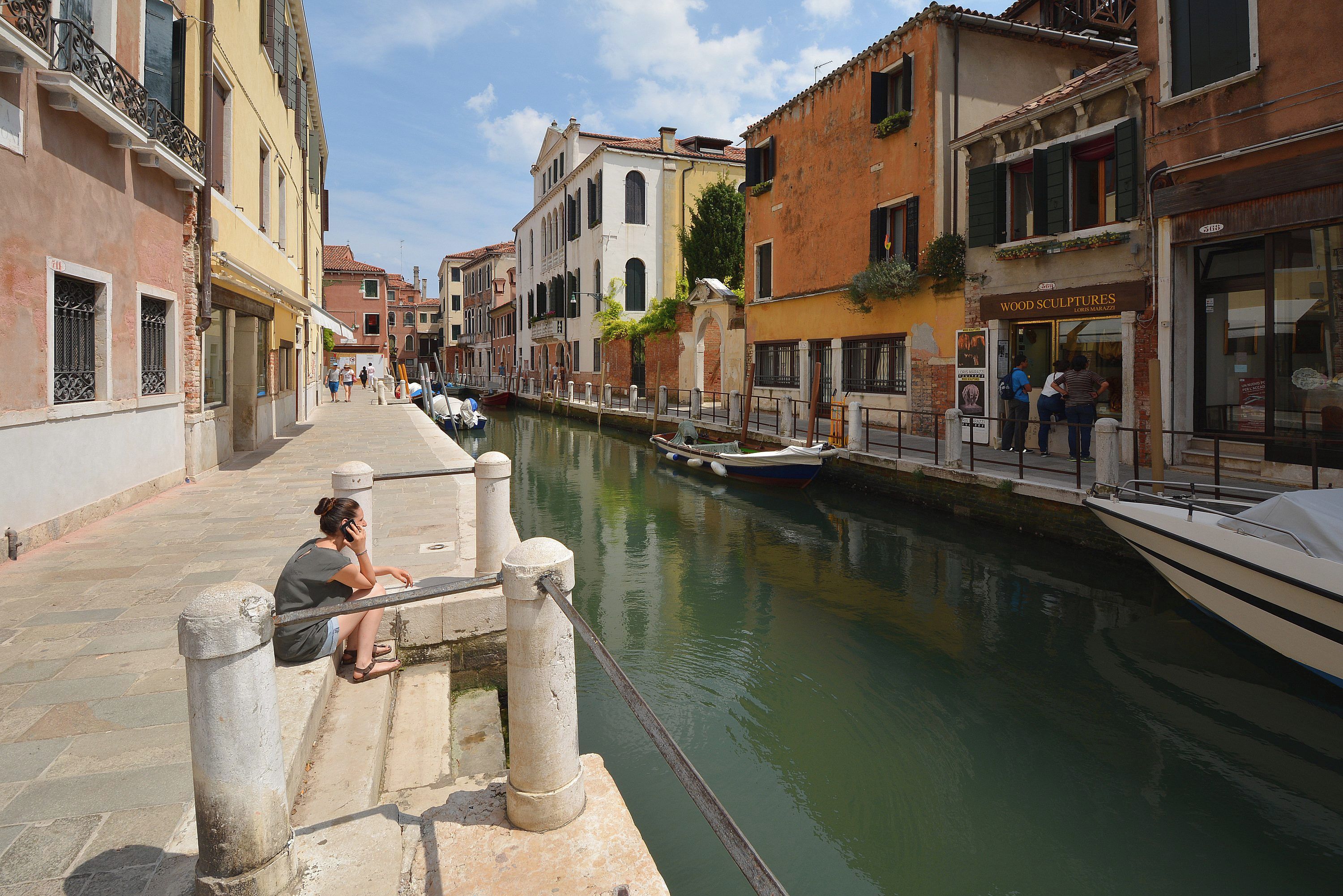 A canal in a historic European town with buildings on either side.